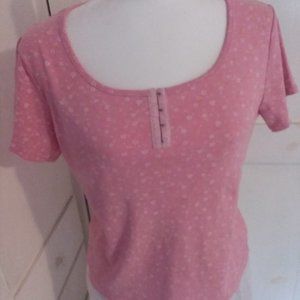 Pink short sleeved top with white flowers